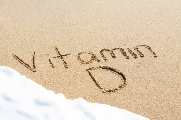  Vitamin D in den Sand geschrieben